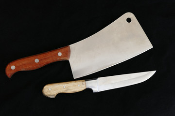 big meat and food knives on black floor,sharp turkish knives with wooden handle on black ground,


