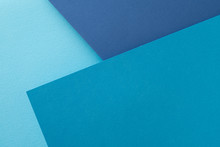 Layered Construction Paper Background. Shades Of Blue Color Abstract Design With Copyspace.