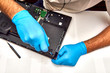 © DannyIacob - Hands of the technician repairing a computer, Professional laptop repair,Close up with selective focus