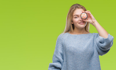 Young caucasian woman eating sweet cupcake over isolated background with a happy face standing and smiling with a confident smile showing teeth