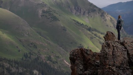 Wall Mural - Tourist admires view from California Pass towards lake Como and Poughkeepsie Gulch