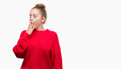 Poster - Young blonde woman wearing bun and red sweater bored yawning tired covering mouth with hand. Restless and sleepiness.