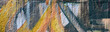 Fragment of graffiti drawings. The old wall decorated with paint stains in the style of street art culture. Colored background texture in warm tones