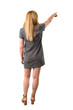 © luismolinero - Middle age blonde woman with grey dress pointing back with the index finger presenting a product from behind on isolated white background