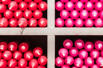 Red and pink paraffin stick candles