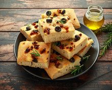 Homemade Italian Focaccia With Sun Dried Tomatoes, Black Olives And Rosemary