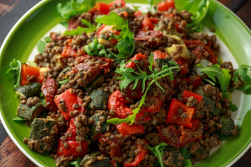 Lentil salad with roasted red pepper, zucchini and dry tomatoes, lemon. healthy food, vegetarian and vegan style