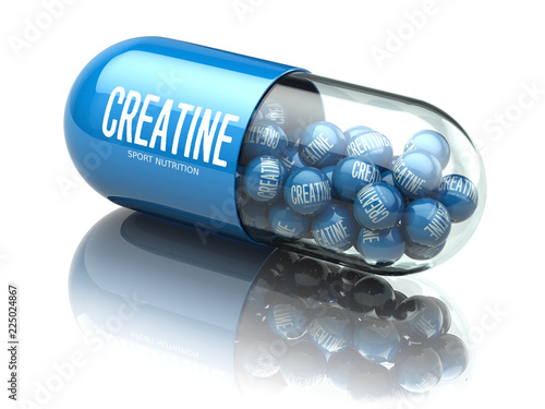 Fotografia Creatine capsiule isolated on white background