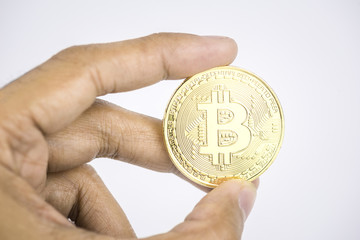 Hand holding golden bitcoin, Belectronic money