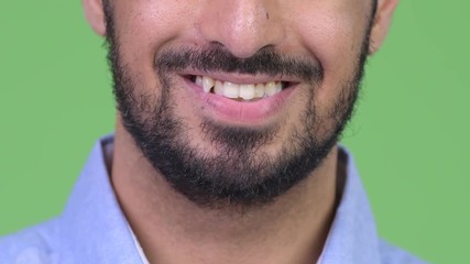 Wall Mural - Smile of young happy bearded Indian man