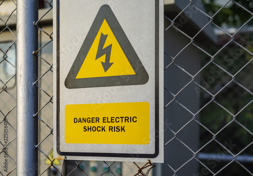 Fotografie, Obraz Danger high voltage sign and background photo