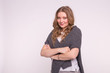 © satura_ - Fashion, style and people concept - attractive young woman with crossed arms over white background with copy space