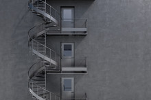 Gray Building With Spiral Fire Escape Stairs