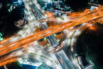 Background scenic road, The light on the road roundabout at night and the city in Bangkok, Thailand. Aerial view. Top view. 