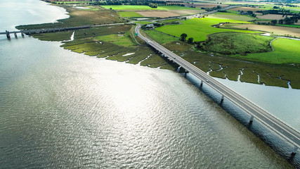 Wall Mural - Aerial image of traffic crossing Clackmannanshire Bridge over the River Forth.