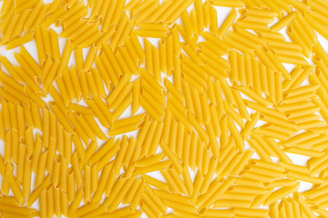 Italian Penne Rigate Macaroni Pasta raw food background or texture close up, top view.