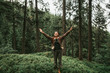 © Yakobchuk Olena - I am happy and free. Full length portrait of spirited young lady with closed eyes enjoying travel in the woods. She is spreading arms with joy and smiling