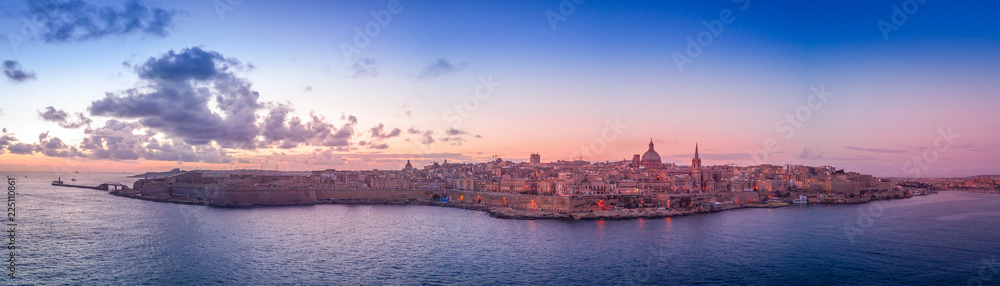 La Valletta sunrise with blue, orange, red, yellow sky in Malta - obrazy, fototapety, plakaty 