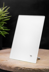 Poster - Blank photo frame on wooden backdrops. Transparent picture frame for your design. Interior decoration.