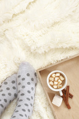 Poster - Woman feet in warm socks and hot chocolate