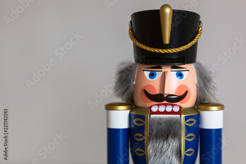 Cuadros en Lienzo Close-up of a handmade wooden Nutcracker Figurine - Soldier in blue Uniform, a t