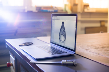 Wall Mural - Laptop engineer lying on cnc milling machine.