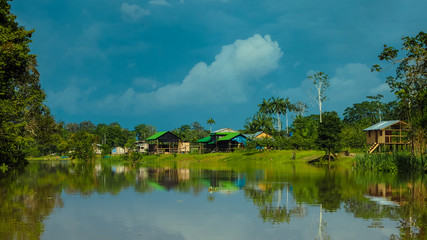 remote village houses at the amazonas river in peru