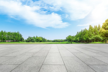 empty square floor and green forest natural scenery in the city park