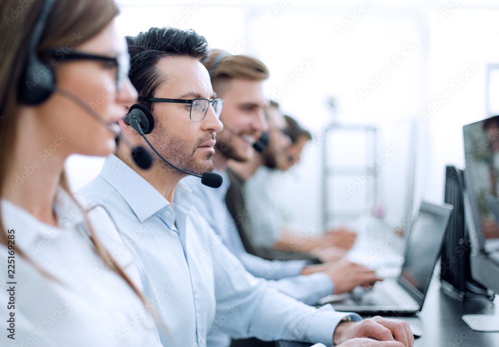 close up.background image of call center employees in the workplace - obrazy, fototapety, plakaty 