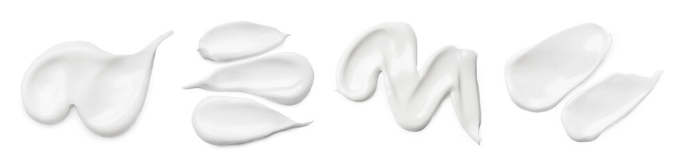 set with different cosmetic smears on white background