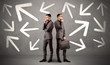 © ra2 studio - Young conflicted businessman choosing between two directions with arrows around him