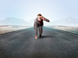 © ra2 studio - Young determined businessman kneeling before blank running track