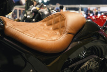 Leather Motorcycle Seat. Motorcycle With Vintage, Leather Seat. Close-up Seat And Wheel Of Bike. Traveling Concept