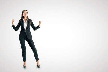 Young european businesswoman celebrating success