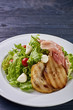 © alexmishchenko - Expensive Italian, Spanish, French salad for festive table. Snack from pear, mozzarella, jamon, greens, lettuce, sauce. Cuisine of France, Spain, Italy. Photo of food for menu, cookbook, culinary blog