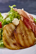 © alexmishchenko - Expensive Italian, Spanish, French salad for festive table. Snack from pear, mozzarella, jamon, greens, lettuce, sauce. Cuisine of France, Spain, Italy. Photo of food for menu, cookbook, culinary blog