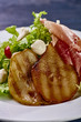 © alexmishchenko - Expensive Italian, Spanish, French salad for festive table. Snack from pear, mozzarella, jamon, greens, lettuce, sauce. Cuisine of France, Spain, Italy. Photo of food for menu, cookbook, culinary blog