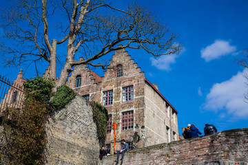 Tourists and the traditional architecture of the historical Bruges town