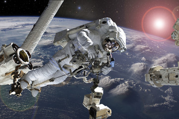 Wall Mural - astronaut flying in outer space near planet earth doing some work near space ship, elements of this 