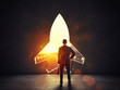 © alphaspirit - Concept of startup with a rocket shape hole in the wall which alludes to the departure towards new goals
