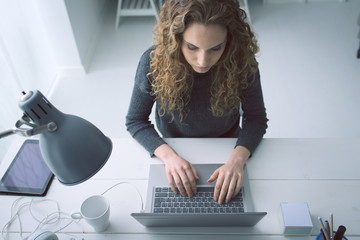 Young woman working with her laptop