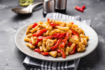 Wall Mural - Pasta with chicken and pepper in tomato sauce