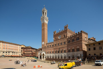 Wall Mural - Siena Italy July 1st 2015 : View of the  Palazzo Publico palace and the Piazza del Campo being prepared for the famous palio horse race