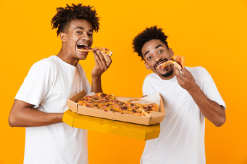 Two joyful male african friends in t-shirts