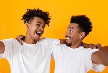 Poster - Two happy male african friends in t-shirts