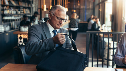 Wall Mural - Senior businessmen at modern cafe