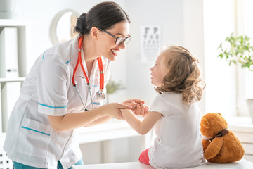 Wall Mural - doctor examining a child