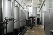 Modern Brewery And Equipment Machinery Tools For Alcohol Production. Steel Vats Or Tanks And Stainless Pipes.