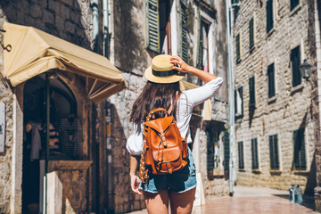 Wall Mural - woman running by kotor city in sunny day