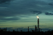 night silhouette industrial landscape - flares for flaring associated gas in an oil field..